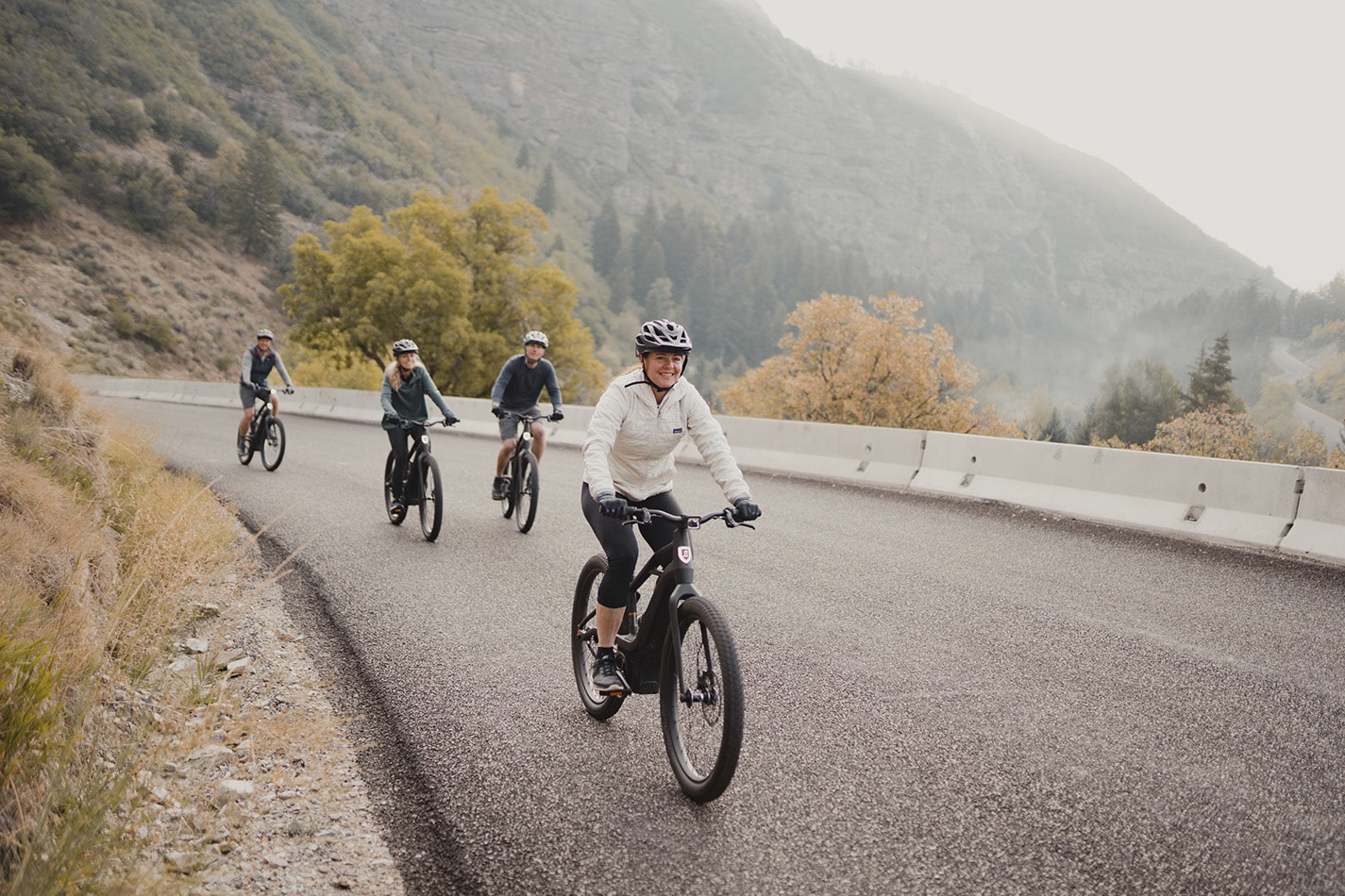 Group of people riding down the mountain on bikes